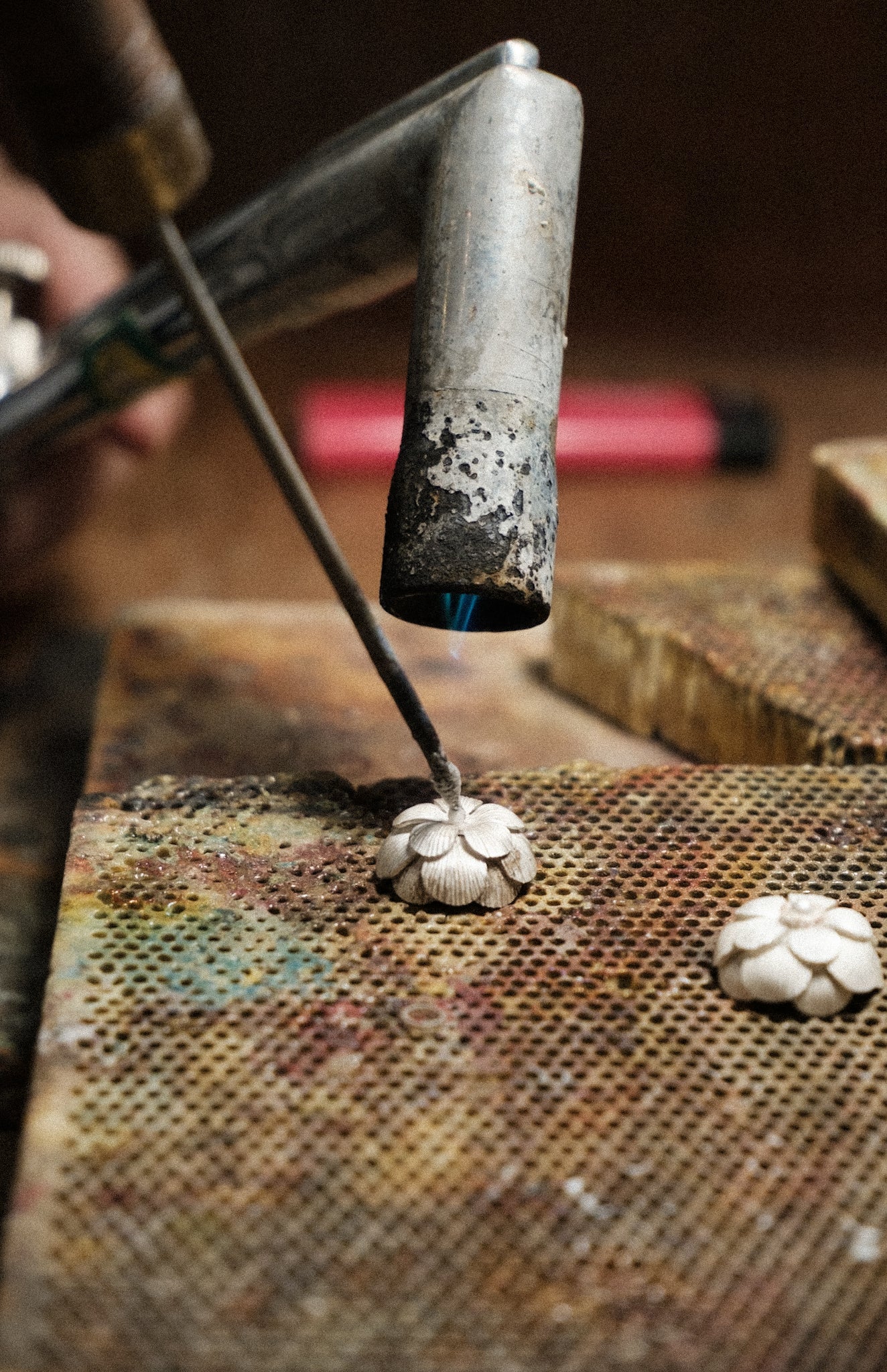 Annealing a silver floral petal in matte white condition.